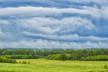 Rainy clouds over a meadow