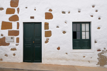 Obraz na płótnie Canvas White-washed facade of an old house in Haria, Lanzarote, Canary islands, Spain