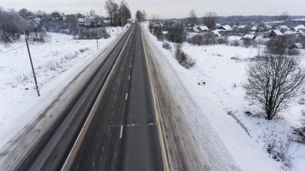 Empty federal highway M10 is in Novgorod district at winter season. The Yazhelbitsy, Russia. Aerial view