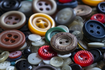 Assorted colored buttons close up