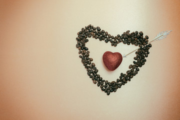 Shimmering red heart inside symbolic heart of coffee beans. Pier