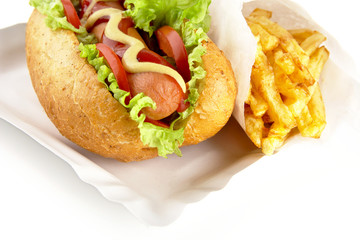 Hotdog on the tray with crisps on white background