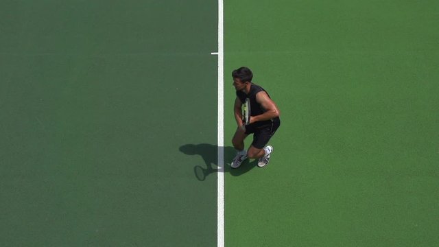 Tennis Player in Great Symmetrical Return.