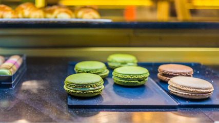 Display of green and pink large macarons