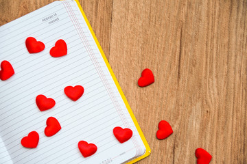 red hearts on valentine's day date  in a calendar