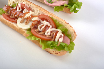 sandwich with sausage and vegetables isolated