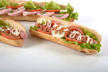 sandwich with sausage and vegetables isolated