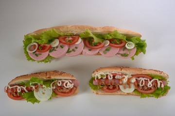 sandwich with sausage and vegetables isolated