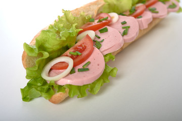 sandwich with sausage and vegetables isolated