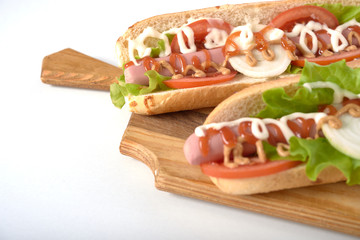sandwich with sausage and vegetables isolated