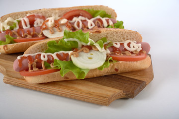sandwich with sausage and vegetables isolated