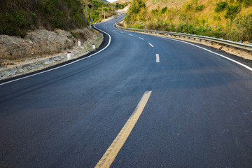 Infinity curved road with yellow line. Concept of adventure, travel, success...