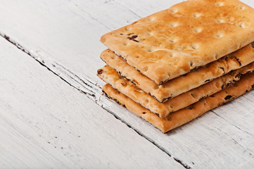Tasty baked cookies on old wooden background.
