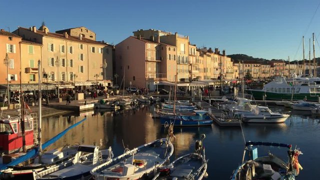 SAINT-TROPEZ, FRANCE - 28 december, 2016: view over St. Tropez's Harbor and the ancient village. Sunny winter day, late afternoon.