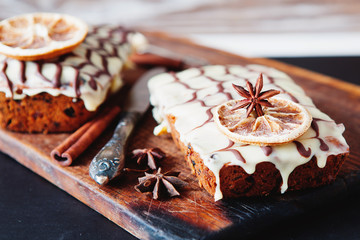 Fruitcake decorated with white and dark chocolate