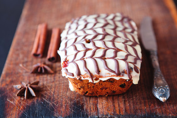 Fruitcake decorated with white and dark chocolate