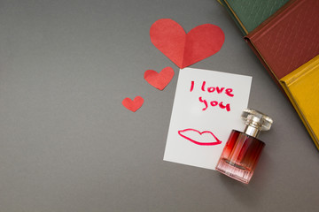 The inscription - I love you and a red heart, perfume.