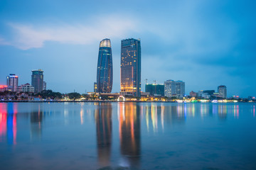 Fototapeta na wymiar Da Nang panorama view by Han river by twilight period. Da Nang is one of the major port city in Vietnam and the biggest city in Central Vietnam