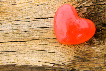Heart shaped soap on wooden background