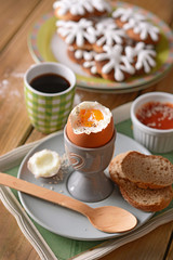 soft-boiled egg with slices of bread for breakfast