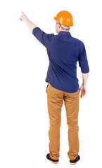 Back view of  pointing young men in  shirt and helmet