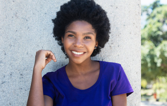 Laughing African American Woman In A Purple Shirt