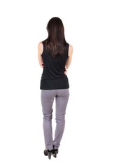 back view of standing young beautiful  woman.