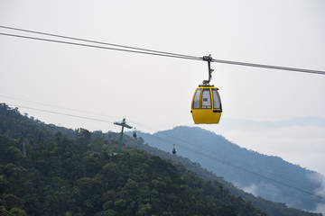 Cable car above hill forest