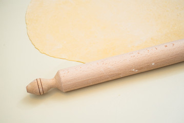Mother and Daughter Hands Kneading Dough on the table.
