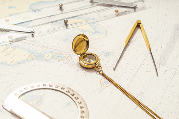 Navigation still-life. Skipper equipment and a map.