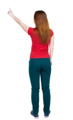 Back view of  pointing woman.