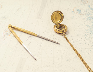 Navigation still-life. Skipper equipment and a map.