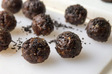 black chocolate balls on a table
