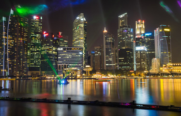Financial and business buildings at Marina Bay with music and light show on foreground