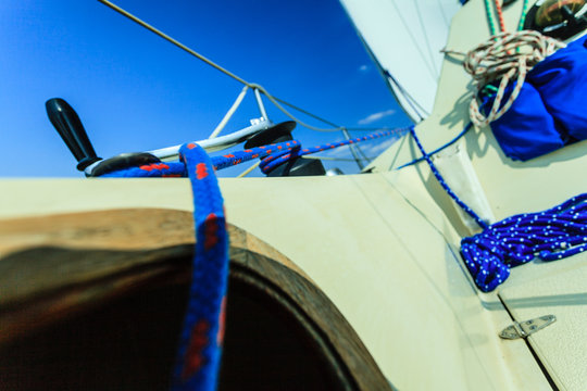 Winch capstan with rope on sailing boat.