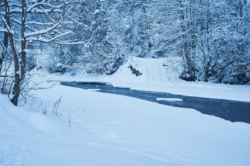 Fototapeta premium Winter mountain river after the snowfall