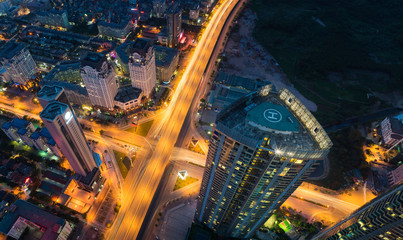 Aerial view of Hanoi cityscape at twilight period with skyscraper and intersection Pham Hung - Duong Dinh Nghe, Tu Liem district, Hanoi, Vietnam. Modern Hanoi city.