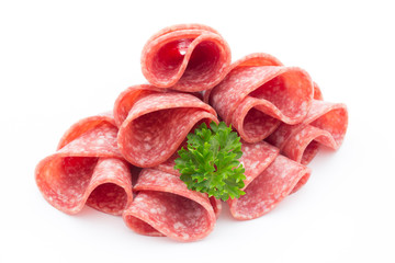 Salami sausage slices isolated on white background.