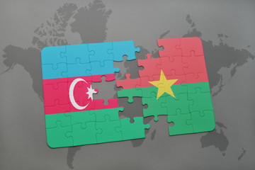 puzzle with the national flag of azerbaijan and burkina faso on a world map