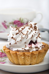 Cake topped with grated chocolate.