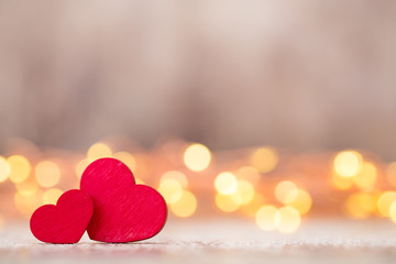 Red hearts on the wooden background.