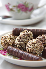 Chocolate candy on the saucer.