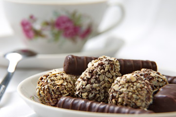 Chocolate candy on the saucer.