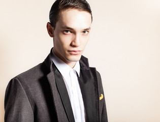 Male fashion model wearing suit. 