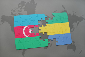 puzzle with the national flag of azerbaijan and gabon on a world map