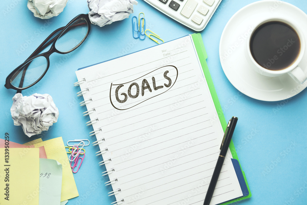 Poster goals text on notebook