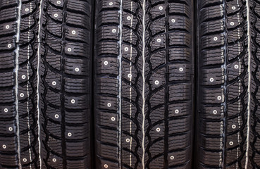 new winter studded  tires in a row