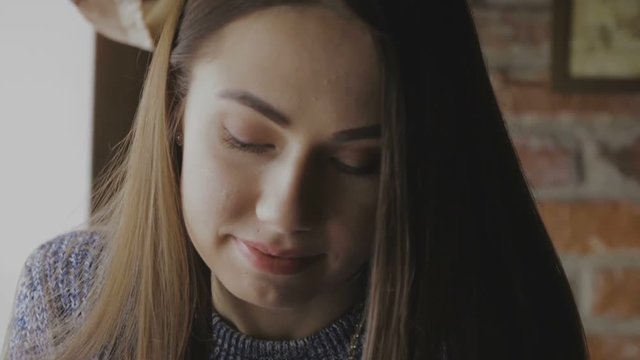 Girl sits at a table in the cafe