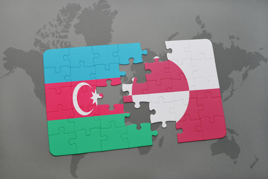 puzzle with the national flag of azerbaijan and greenland on a world map