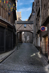 Wooden balcony connecting two houses in old city part of Saint-Malo, France